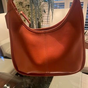 Soft leather orange coach purse.   Beautiful handbag.